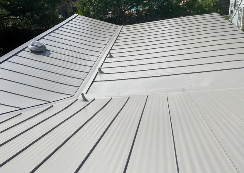 Solar attic fan installed on a metal roof for Roof Ventilation in San Benito